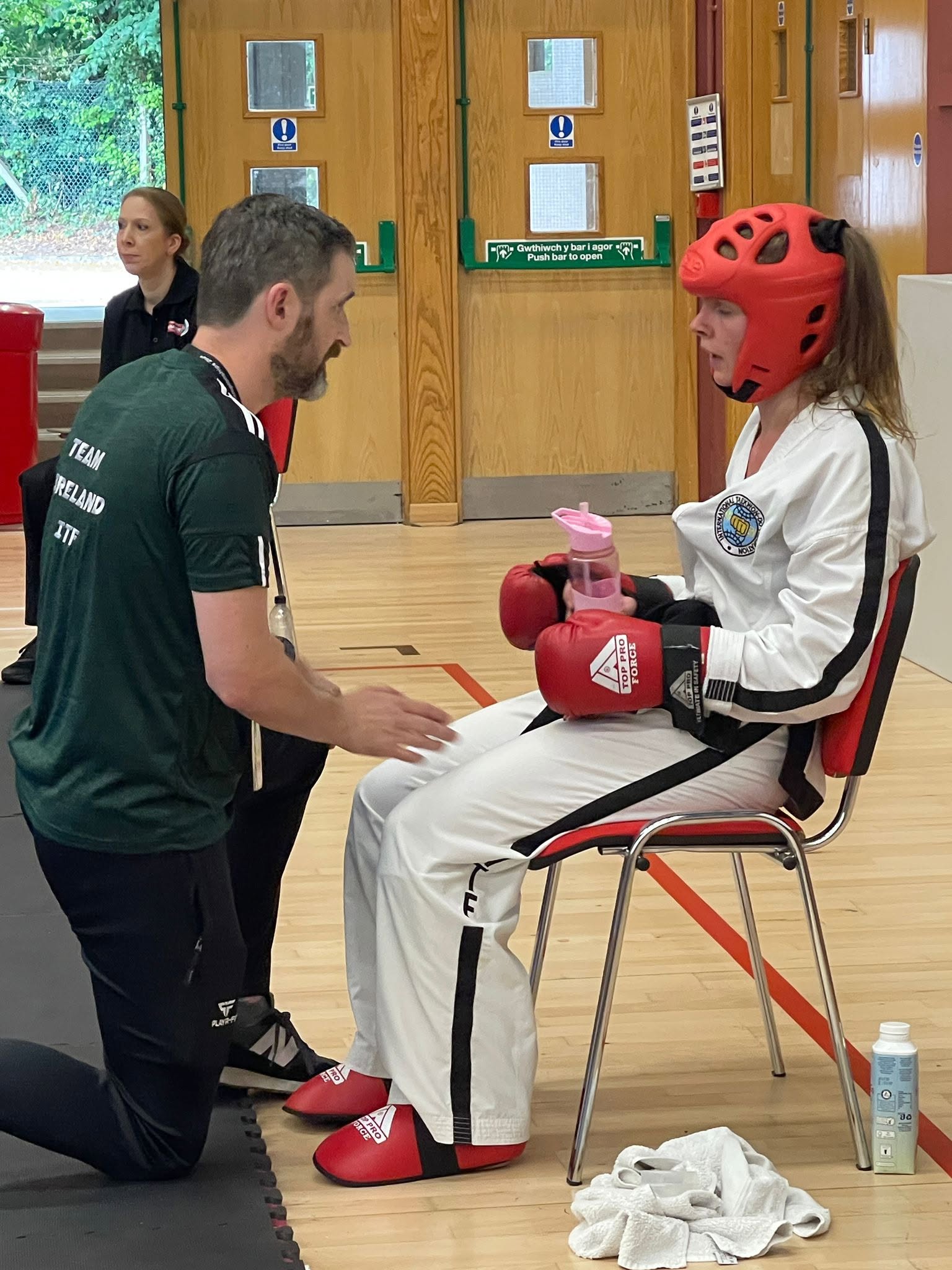 Coach giving corner instructions to a sparring competitor